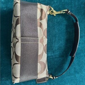 Coach Signature Brown and Cream Zipper Hand Bag. 10” x 3”